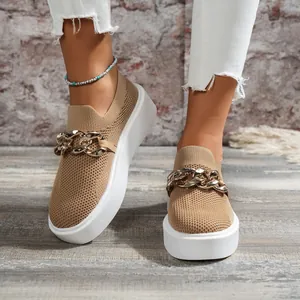 Detail view of women's tan fly-woven platform loafers with chunky gold chain link