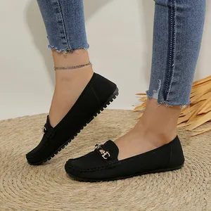 Stylish black casual women's loafers featuring a classic gold metal buckle and soft flat sole