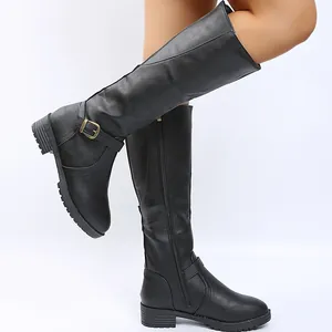 Detail view of black knee-high knight boots with side zipper and decorative buckle strap.