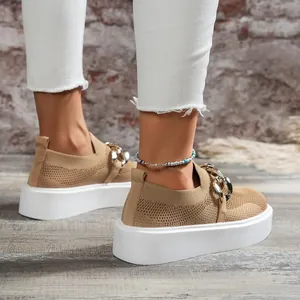 Side view of women's khaki fly-woven loafers with chunky white sole and chain