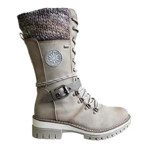 Detail view of women's mid-calf winter boots with knitted collar and buckle strap