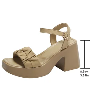 Beige ankle strap sandals with a 3.34 inch block heel and pleated front strap design.