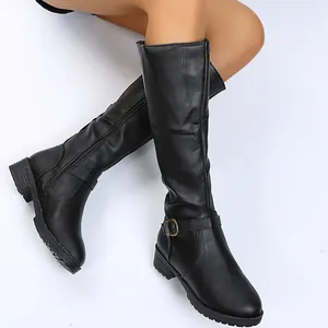 Stylish black knee-high leather boots featuring buckle strap and zipper shown on legs