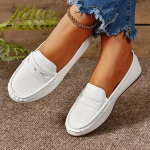 Stylish white textured leather flat loafers for women with a comfortable slip-on design