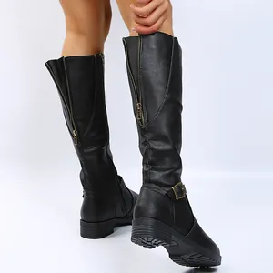 Detailed macro view of black knee-high knight boots featuring a back zipper and low heel