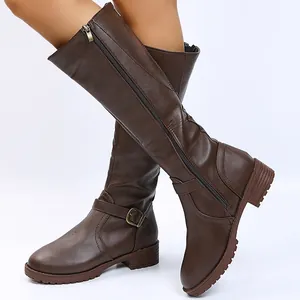 Detailed view of women's brown knee-high knight boots with side zipper and buckle.
