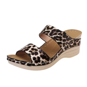Detailed side view of stylish leopard print wedge sandals with comfortable beige platform soles