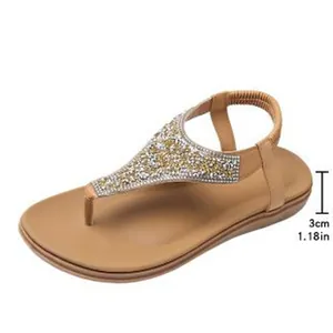 Detail view of bohemian flat sandals showing 3cm heel height with rhinestones