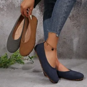Detail view of women's casual suede slip-on flat shoes in blue, brown and grey colors