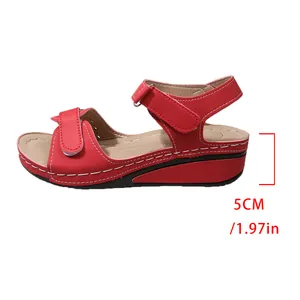 Detail showing the 5cm wedge heel height on vintage red platform sandals for women.