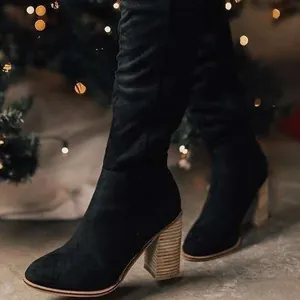 Elegant black suede over-the-knee boots featuring a stylish block heel for winter season