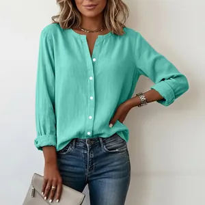 Close-up of mint green slub cotton casual shirt with stand collar and buttons