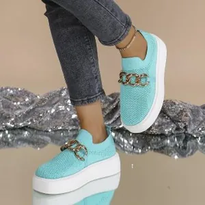 Detailed view of breathable mesh loafers featuring gold chain and thick platform sole