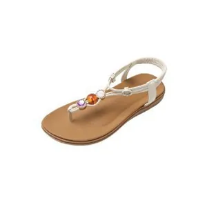 Detailed view of Bohemian T-strap flat sandals with colorful decorative beads