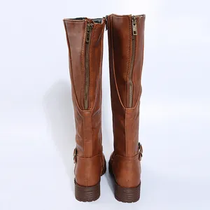 Back view of women's brown tall leather boots with full-length zippers and low heels