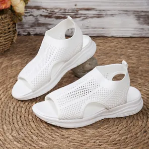 Close-up detail of white breathable mesh hollow wedge platform sandals for women