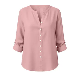 Detailed view of pink slub cotton blouse featuring stand collar and button-up front