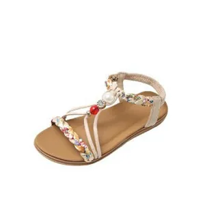 Elegant bohemian flat T-strap sandals with braided details and decorative pearl beads