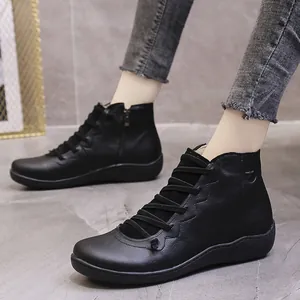 Stylish black leather ankle boots for women, featuring a comfortable flat sole and side zipper.