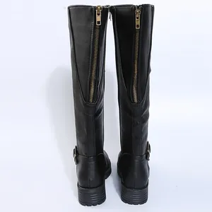 Detailed back view of black knee-high knight boots featuring metallic rear zippers.