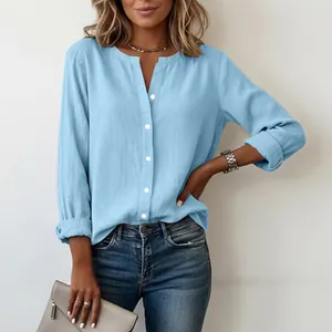 Close-up of a women's slub cotton shirt with a mandarin collar and light blue hue