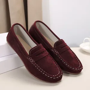 Elegant burgundy suede women's loafers featuring white contrast stitching and round toe detail