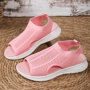 Close-up detail of women pink mesh peep-toe wedge sandals with a white platform sole