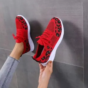 Stylish red leopard print mesh sneakers with comfortable white flat sole and red laces