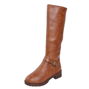 Close-up of brown faux leather knee-high riding boots with side zipper and buckle detail.