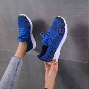 Lightweight blue mesh women's sneakers featuring stylish leopard print and lace-up details