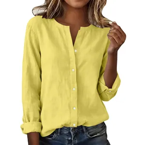 Close-up detail of a yellow slub cotton women's shirt featuring a casual stand collar.