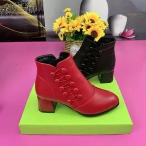 Elegant red and black pointed toe ankle boots with chunky mid heels for winter season.