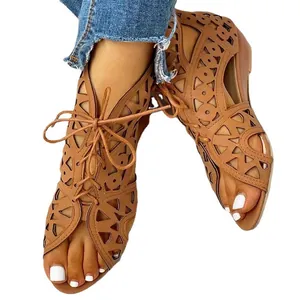 Women's tan lace-up peep-toe hollow wedge sandals with cut-out design on white back
