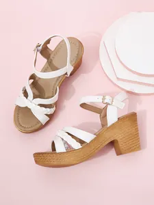 White chunky heel sandals with elegant braided straps and ankle buckle closure