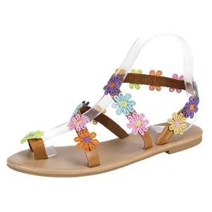 Detail view of Bohemian flat sandals with colorful floral embroidery decoration