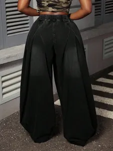 Detailed back view of vintage washed black wide-leg lantern jeans with elastic high waist.