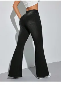 Rear view of black high-waisted elastic flare jeans showing slim fit and bell bottom style