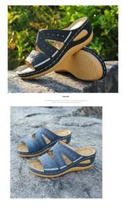 Vista detallada del bordado floral en las elegantes sandalias de cuña para mujer