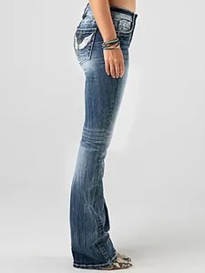 Detailed side view of high-waisted flared jeans with intricate wing embroidery on pocket.