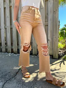 Women's high-waisted ripped straight-leg jeans in tan with frayed hem and distressing