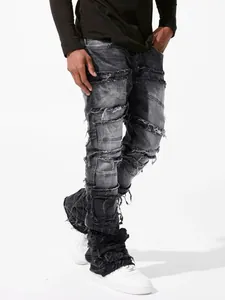Close-up detail of men's distressed patchwork straight-leg denim jeans on model
