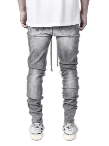 Back view of men's distressed skinny grey jeans with ripped detailing