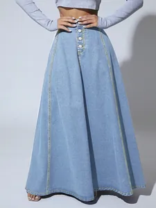 High-waisted A-line denim maxi skirt with front button detail and contrast stitching