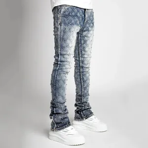 Men's stylish stacked denim jeans featuring pearl embellishments and acid wash finish.