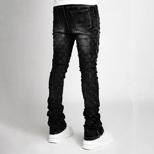 Men's black stacked jeans with sparkling rhinestone embellishments and slim fit style.