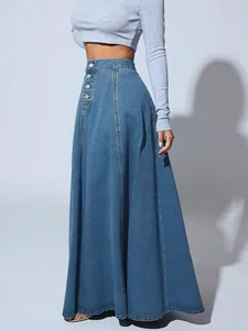 Detailed side view of a stylish high-waisted blue denim A-line skirt with button accents