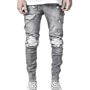 Men's grey ripped skinny jeans with distressed biker holes and stretch fit for casual wear.