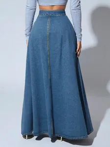 Back view of high-waisted denim A-line maxi skirt with contrast stitching
