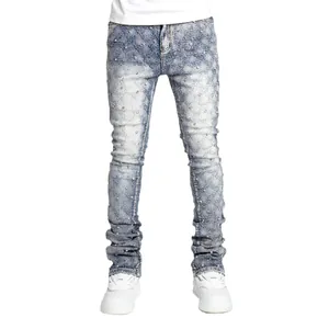 Men's light blue slim fit stacked denim jeans with pearl stud embellishments throughout