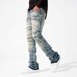 Men's street fashion straight-leg jeans with distressed patches and raw hems